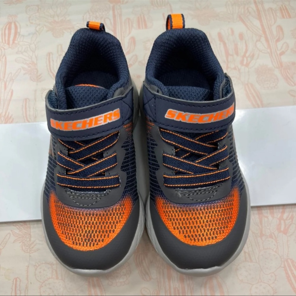 Blue and orange Skechers